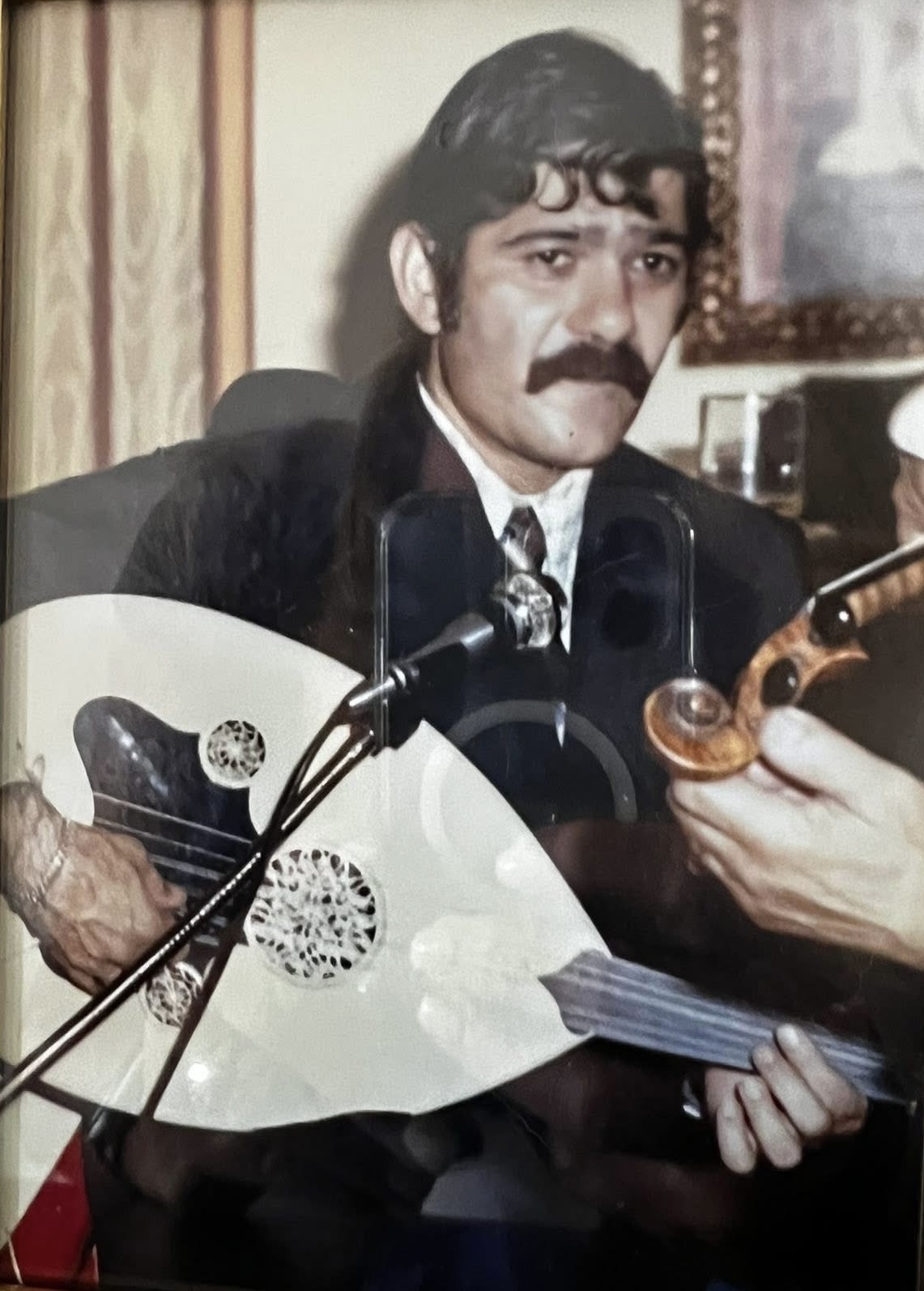 Young Robert Mardirosian playing the oud