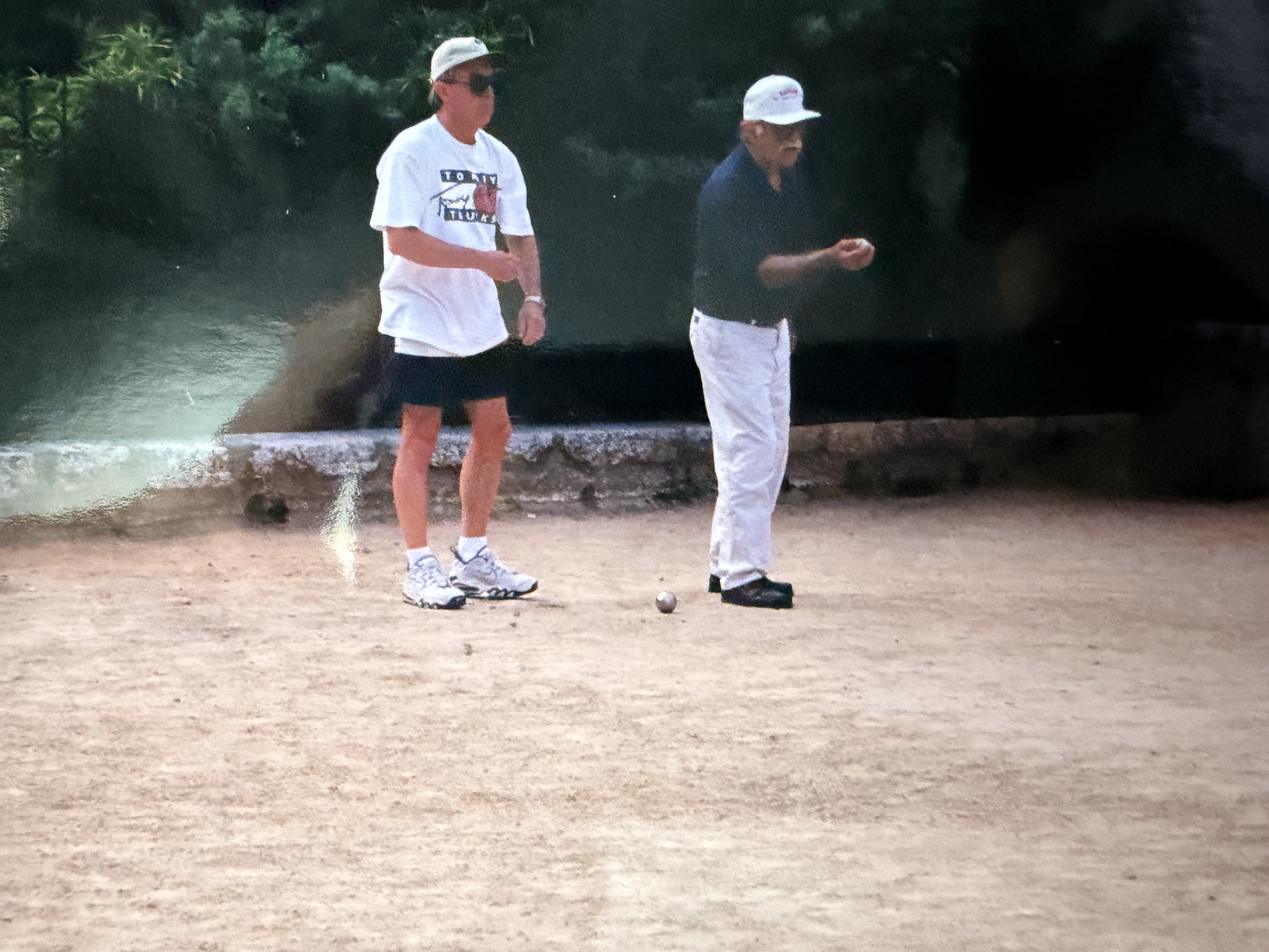 Bob (right) playing pétanque